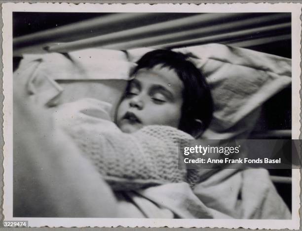 Portrait of Anne Frank sleeping, Frankfurt am Main, Germany. From Anne Frank's photo album.