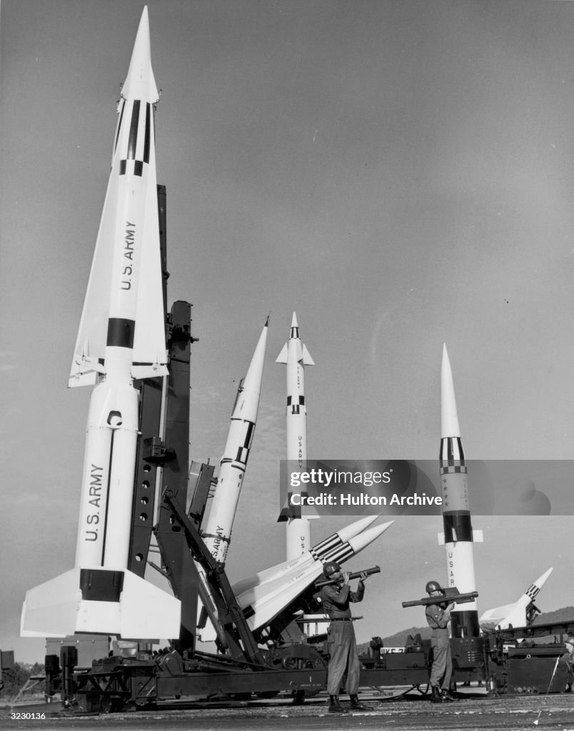 Small Military Rockets Two soldiers hold rocket launchers as they stand with the U.S. Army ...