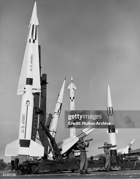 Soldiers With Rockets Two soldiers hold rocket launchers as they stand with the U.S. Army ...