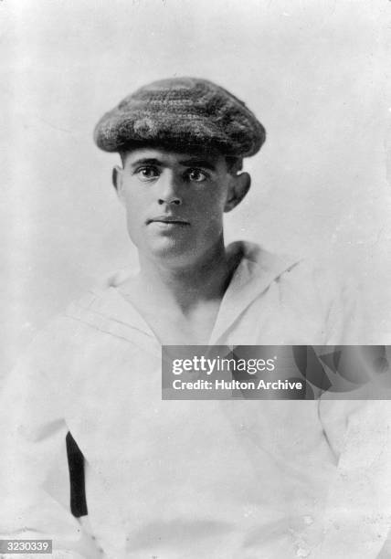 Studio portrait of American writer Jack London wearing a middy and a knit cap.