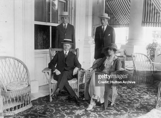 Portrait of Calvin Coolidge , his wife Grace and his sons John and Calvin Jr , posing on their porch in Massachusetts. Coolidge became vice-president...