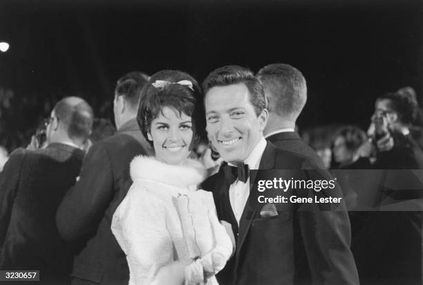 American pop singer Andy Williams smiles with his wife, French singer Claudine Longet, while arriving at the Academy Awards, Santa Monica,...