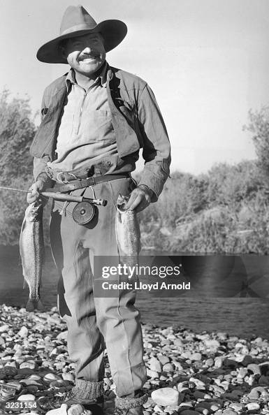 Hemingway Photo Full-length portrait of American author Ernest Hemingway smiling ...