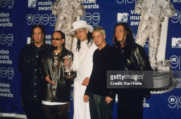 Rock group Korn, featuring Jonathan Davis, stands with their award at the MTV Video Music Awards at the Metropolitan Opera House at Lincoln Center,...