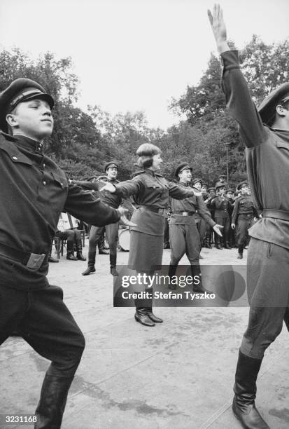 The Red Army Ensemble entertain Soviet troops in their encampment in a Prague park during their country's invasion of Czechoslovakia.