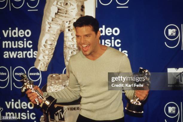 Puerto Rican music star Ricky Martin holds two of his awards at the MTV Video Music Awards at the Metropolitan Opera House at Lincoln Center, New...