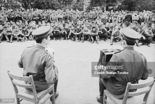 The Red Army Ensemble entertaining Soviet troops at their encampment in a Prague park during their country's invasion of Czechoslovakia.