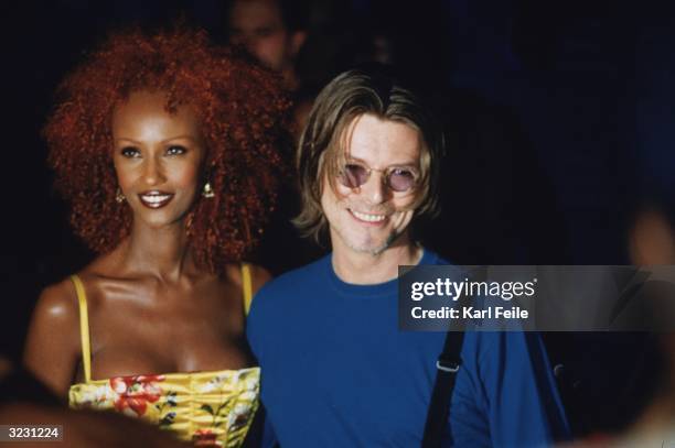 Somalian supermodel Iman stands with her husband, British pop singer David Bowie, at the MTV Video Music Awards at the Metropolitan Opera House at...