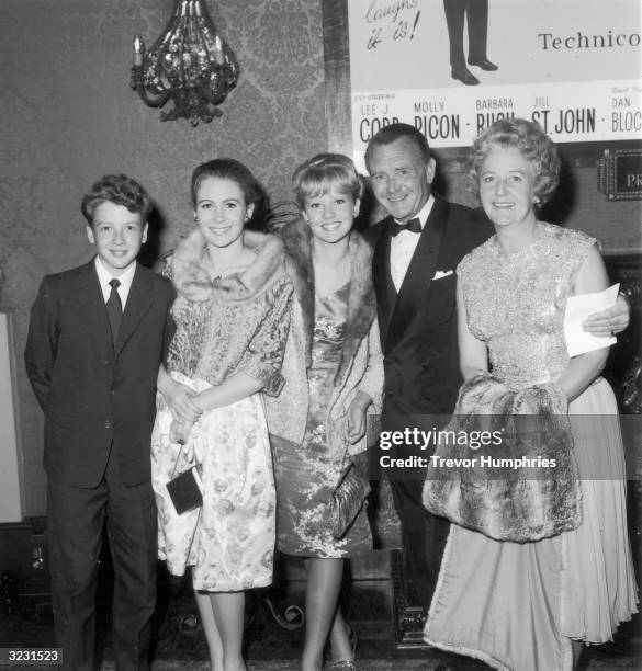 The Mills family at the Plaza theatre, where they watched the premiere of 'Come Blow Your Horn' starring Frank Sinatra. Left to right : Jonathon,...