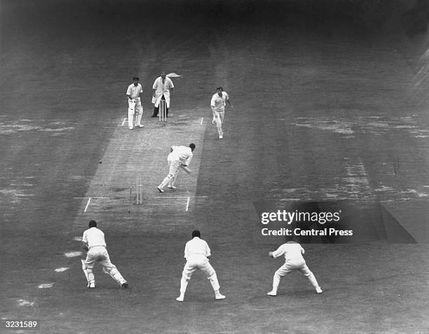 English bowler David Brown takes the wicket of South African wicketkeeper Denis Lindsay during South Africa's second innings against England in the...