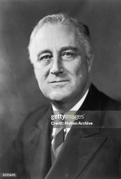 Studio headshot portrait of American president Franklin Delano Roosevelt .