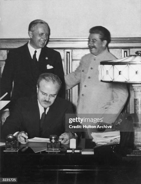 Joachim von Ribbentrop , German foreign minister, Soviet premier Joseph Stalin, and Viachislav Mikhailovich Molotov , Soviet foreign minister,...