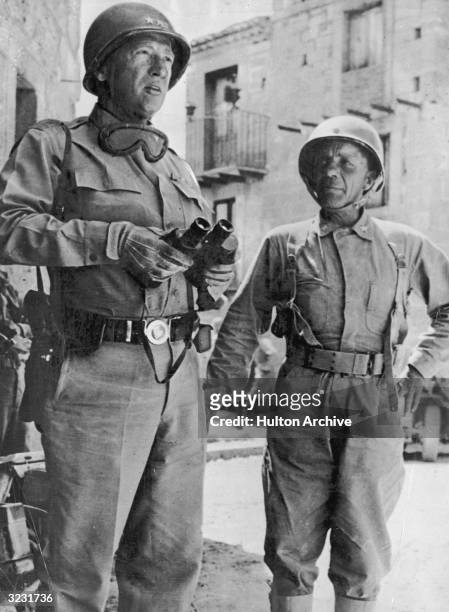General George Patton confers with Assistant Commanding General Theodore Roosevelt Jr during the US Invasion of Sicily, July 1943.