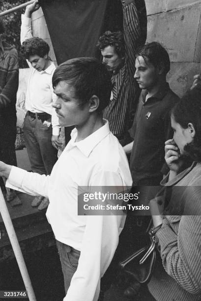 Czechoslovakian students raise black flags as they mourn one of their number killed in the first few days of the Soviet invasion of Prague.