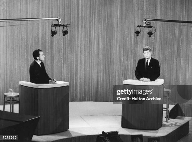 Republican vice president Richard Nixon and democratic senator John F. Kennedy take part in a televised debate during their presidential campaign.