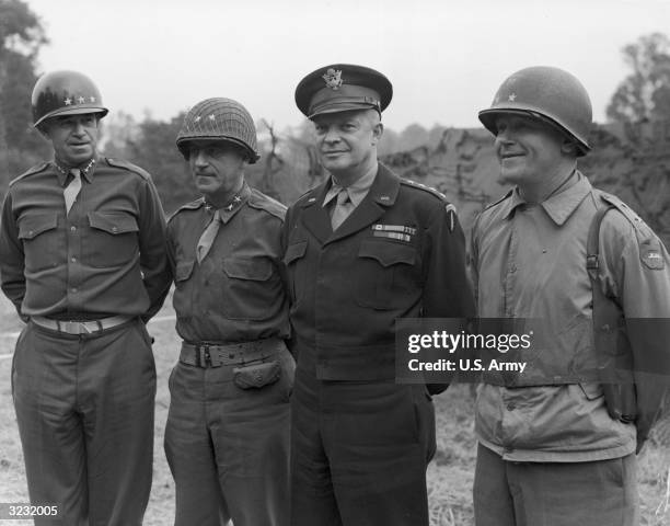 Lieutenant General Omar Bradley , Major General Leonard Gerow , General Dwight Eisenhower , and Major General J. Lawton Collins in uniform, smiling...