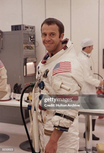 Portrait of Apollo 14 mission commander Alan B. Shepard Jr., wearing a spacesuit, smiles during preparation activities for the liftoff to the moon,...