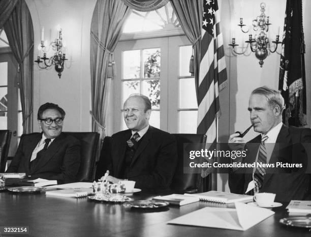 Left to right: US Secretary of State Henry Kissinger, President Gerald Ford and Secretary of Defense James Schlesinger in a Cabinet meeting at the...