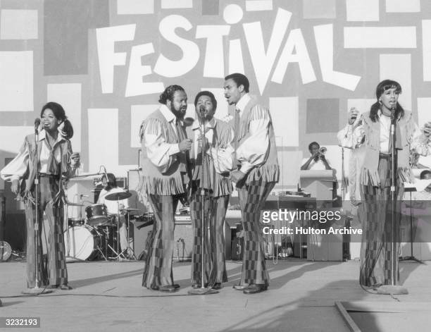 American pop vocal group, The 5th Dimension, performs on stage, backed by a horn section, for the Harlem Cultural Festival, Mount Morris Park,...
