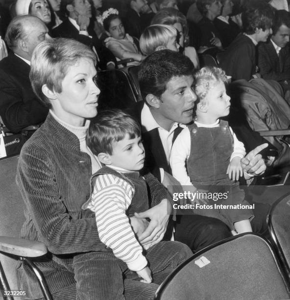 American actor and singer Frankie Avalon sits in the audience with his wife, Kay, and their two sons, as they attend the Dobritch International...