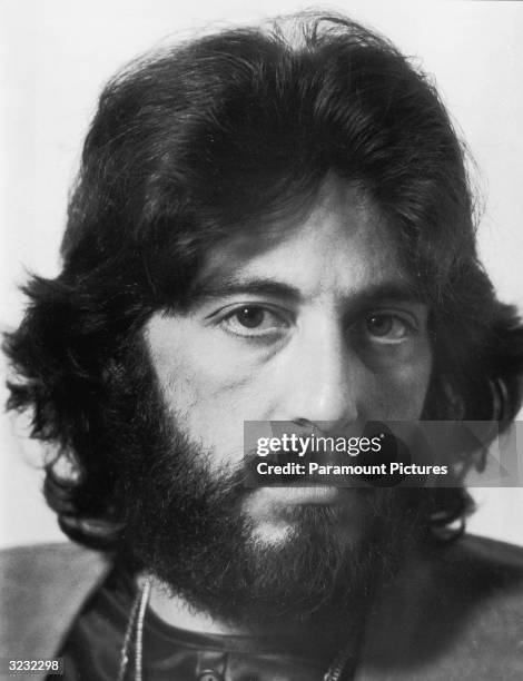 Promotional headshot portrait of American actor Al Pacino with shaggy hair and a beard, for director Sidney Lumet's film, 'Serpico'. The film was...