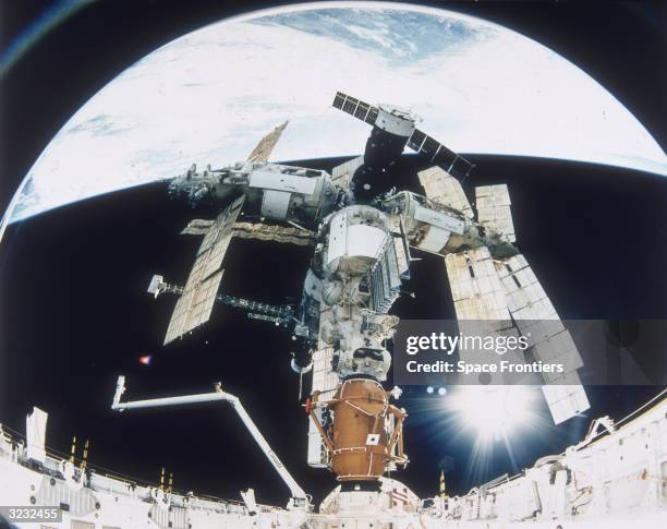 S STS-74 Atlantis Space Shuttle docked with Russia's MIR Space Station. This mission is part of the first phase of the International Space Program...