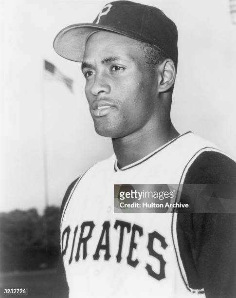 Headshot of Puerto Rican baseball player Roberto Clemente of the Pittsburgh Pirates at a baseball field in uniform.