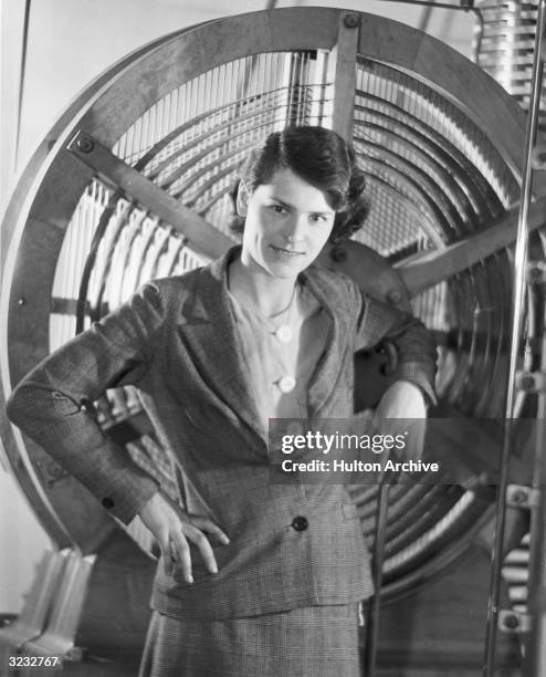 Portrait of American photographer Margaret Bourke-White posing with equipment she used for a mural at Radio City Music Hall, New York City.