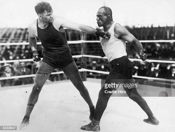 American boxer Jack Dempsey training in the ring with Wrestler 'Bull ...