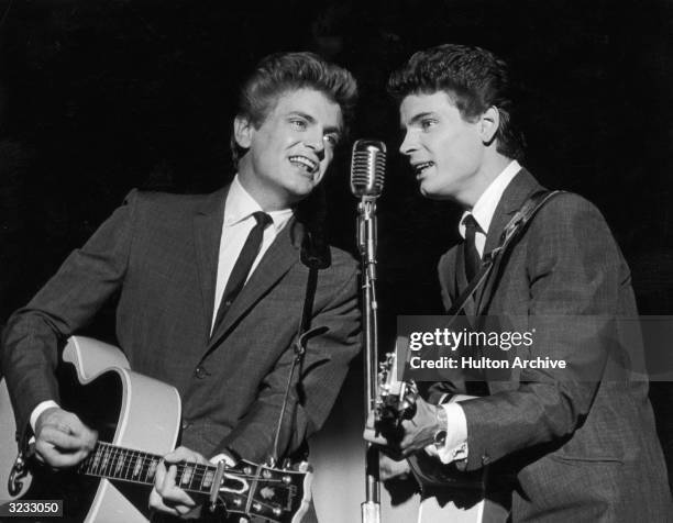 Phil and Don Everly, the American rock n' roll duo the Everly Brothers on stage.