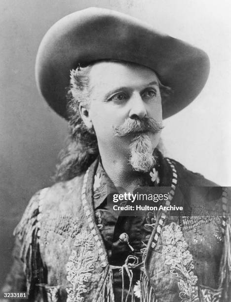 Portrait of American showman, army scout, and pony express rider William F Cody a.k.a. 'Buffalo Bill,' wearing a cowboy hat and an embroidered,...