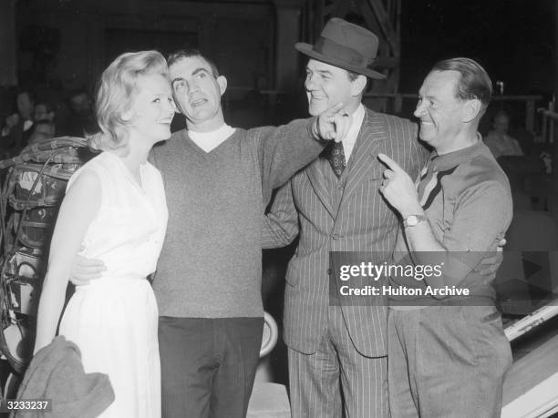 American actor Lee Remick , American director Blake Edwards, American actor Karl Malden, and British-born cinematographer Harry Stradling stand with...