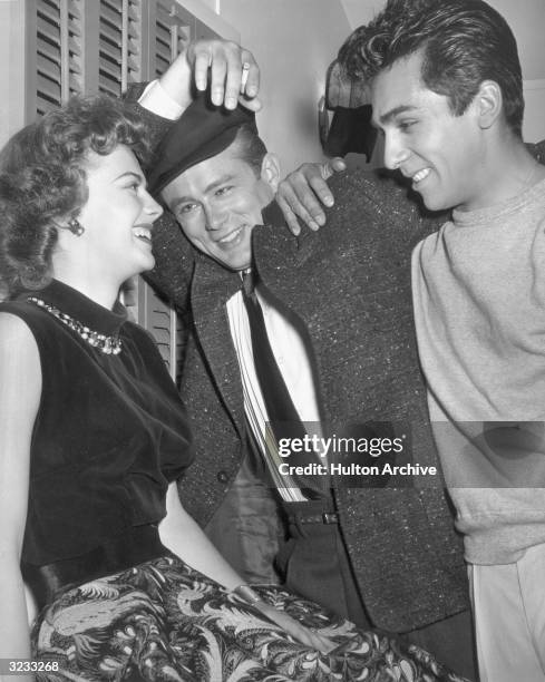 American actor Perry Lopez visits Natalie Wood and James Dean on the set of director Nicholas Ray's film, 'Rebel Without a Cause', 1955.
