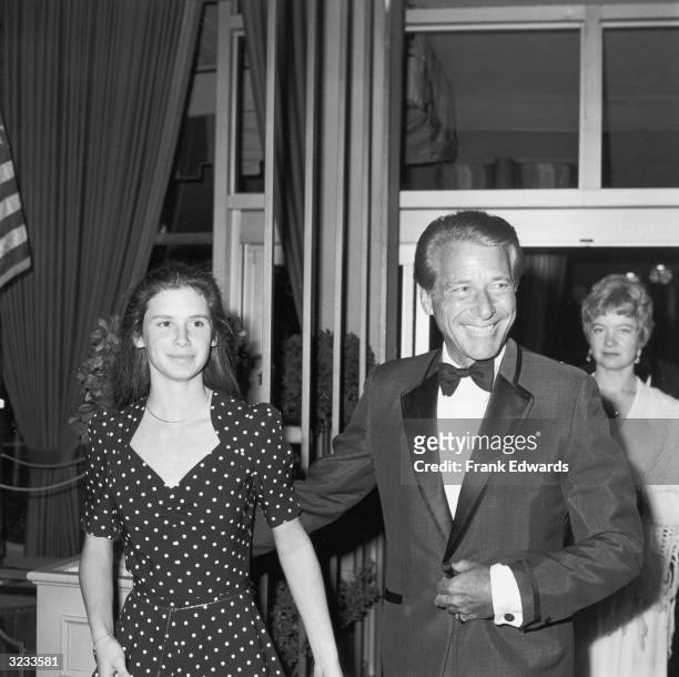 American actor Efrem Zimbalist, Jr., wearing a tuxedo, with his arm around his daughter, actor Stephanie Zimbalist, at the 34th Annual Golden Globe...