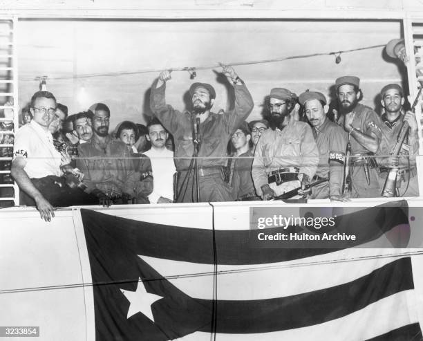 Cuban President Fidel Castro speaking from a podium to the people of Camaguey, Cuba about the Triumph of the Cuban Revolution three days before...