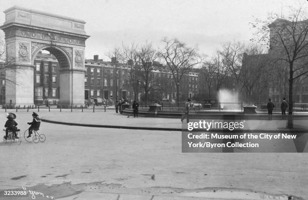 View from within Washington Square Park, looking northeast over the central fountain with the Arch at left, New York City.