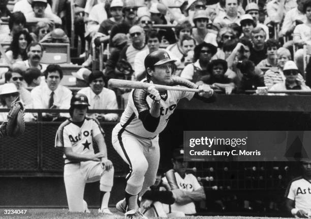 American baseball player Nolan Ryan of the Houston Astros bunts for a base hit in the third inning of a game against the Mets at Shea Stadium,...