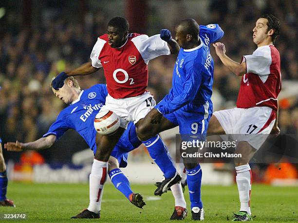 Kolo Toure of Arsenal battles for the ball with Damien Duff and Jimmy Floyd Hasselbaink of Chelsea during the UEFA Champions League Quarter Final...