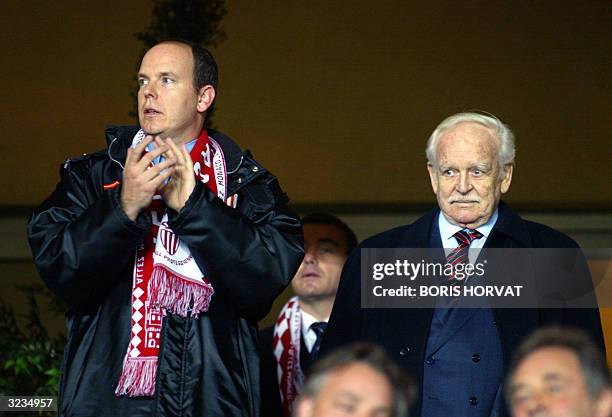 Prince Rainier of Monaco and his son Prince Albert watche the Champions League quarter-final second leg football match between Monaco and Real...