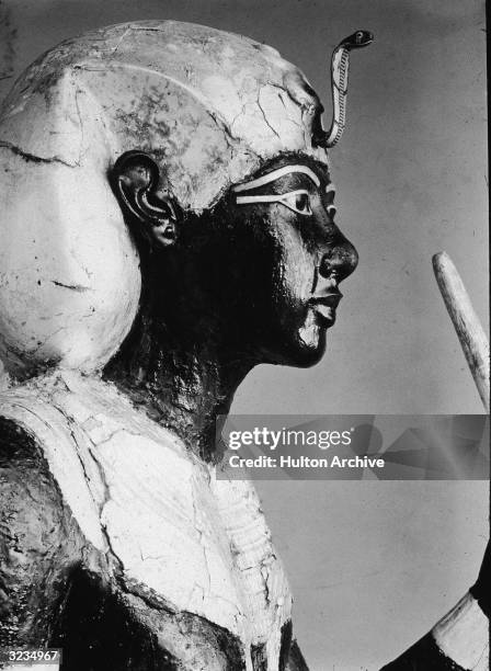 Profile of a wooden statue of King Tutankhamen , excavated from his burial tomb on Howard Carter's expedition, 1922.