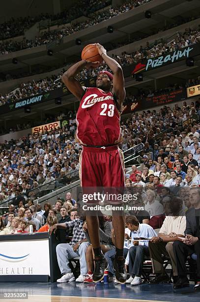 LeBron James of the Cleveland Cavaliers shoots against the Dallas Mavericks during the game at American Airlines Arena on March 30, 2004 in Dallas,...