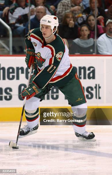 Defenseman Filip Kuba of the Minnesota Wild controls the puck during the game against the Phoenix Coyotes at Glendale Arena on March 7, 2004 in...