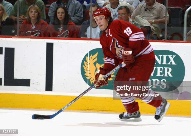 Left wing Shane Doan of the Phoenix Coyotes advances the puck during the game against the Minnesota Wild at Glendale Arena on March 7, 2004 in...