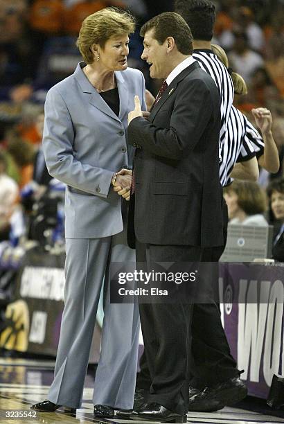 Head coach Pat Summitt of the Tennessee Lady Vols and head coach Geno Auriemma of the University of Connecticut Huskies meet before the National...