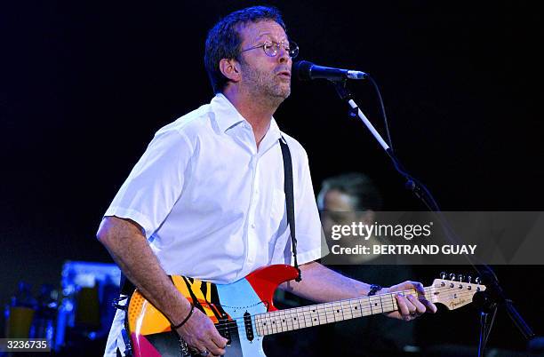 British guitarist and singer Eric Clapton performs at the Bercy hall in Paris 06 April 2004 to present his new album "Me & Mr Johnson" as part of an...