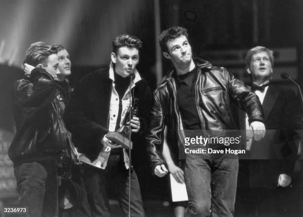 Scottish band Wet Wet Wet are voted Best British Newcomer at the Brit Awards, held at London's Albert Hall, 9th February 1988. From left to right,...