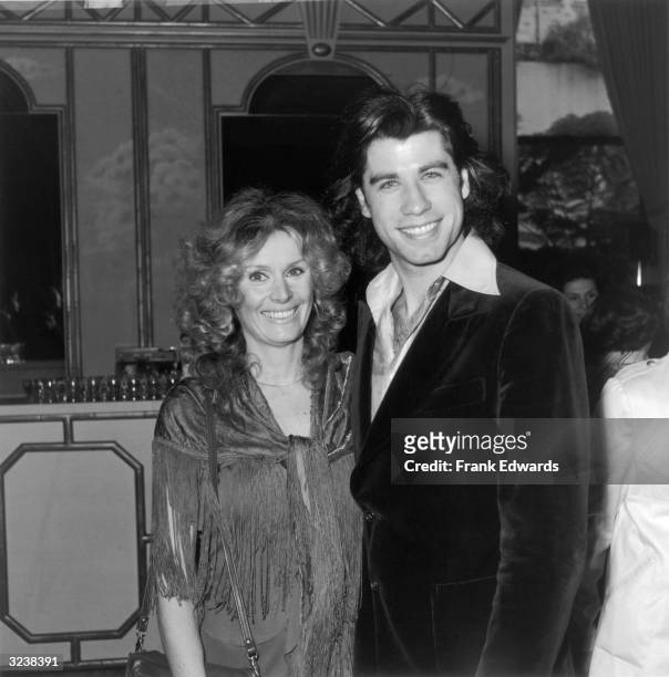 American actors John Travolta and Diana Hyland smile as they pose together at the 36th Annual Golden Apple Awards at the Beverly Wilshire Hotel,...