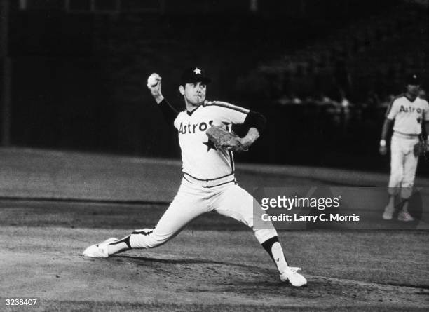 American baseball player Nolan Ryan of the Houston Astros pitches during a game against the New York Mets, in which he struck out 12 batters, Shea...