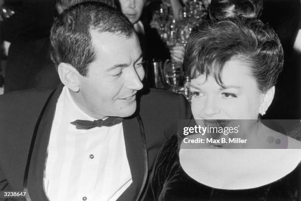 Married American actors Judy Garland and Mark Herron at a formal Hollywood event, California.