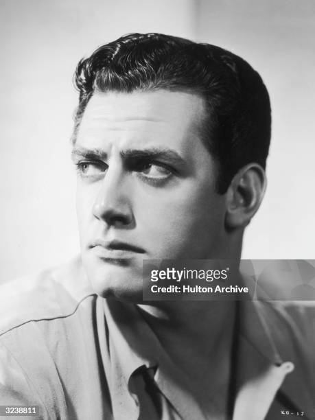 Headshot studio portrait of Canadian actor Raymond Burr looking to the side..